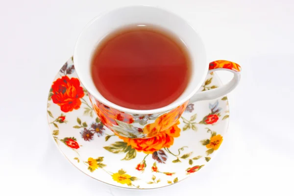 Tasse à thé classique avec des fleurs rouges et orange — Photo