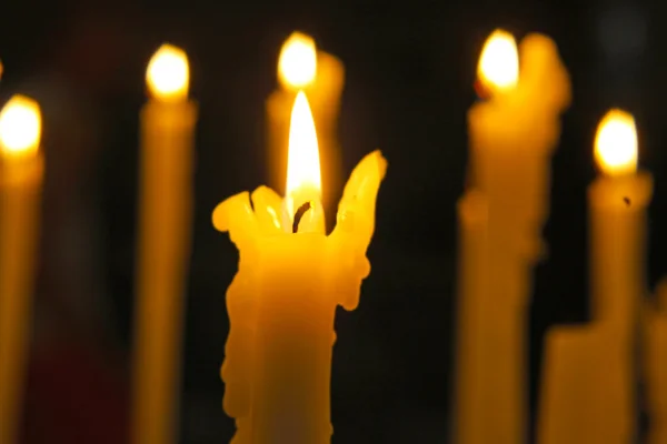 Close up view of the candles cutting through the darkness. — Stock Photo, Image