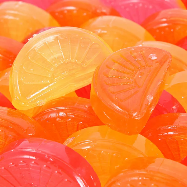 Colorful red, yellow and orange candies background — Stock Photo, Image