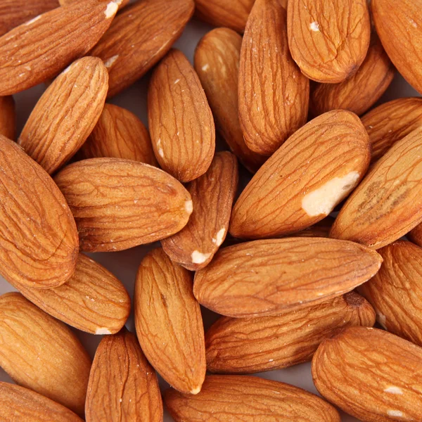 Tasty almond nuts, close up — Stock Photo, Image