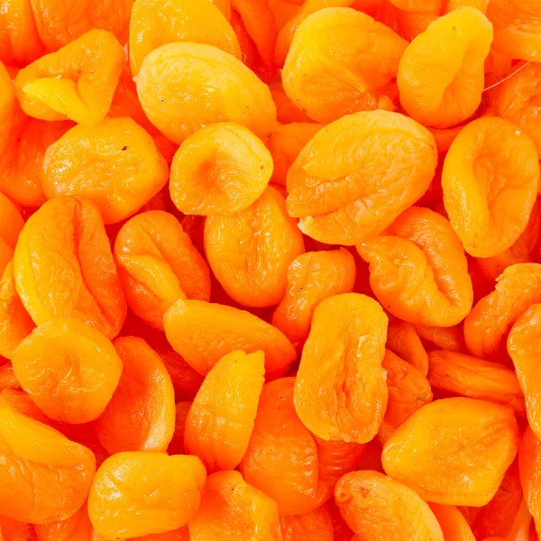 Dry apricots arranged at the background — Stock Photo, Image