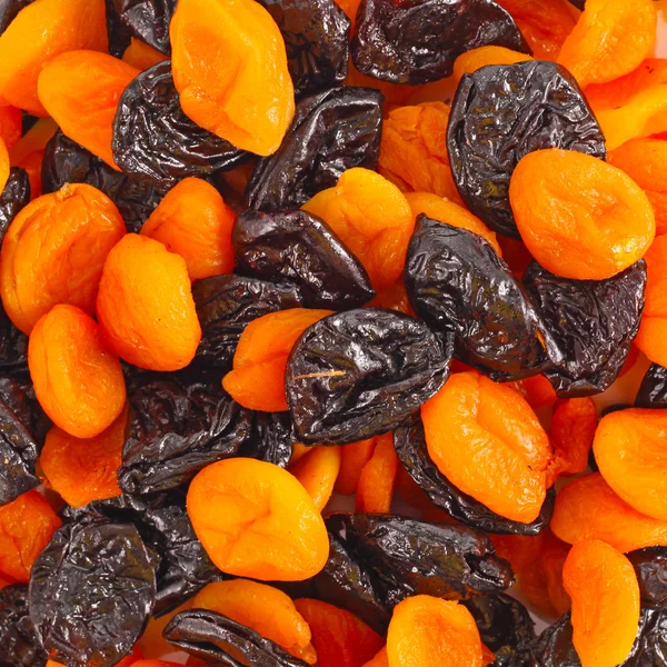 Mixed dried fruits background — Stock Photo, Image