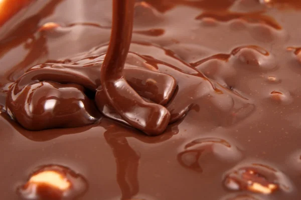 Chocolate falling from above — Stock Photo, Image