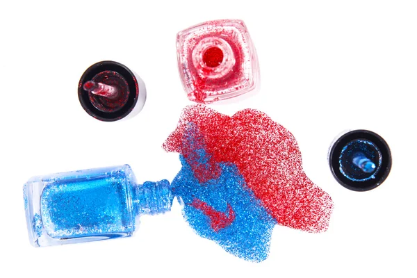 Spilled nail polish bottles and splashes — Stock Photo, Image