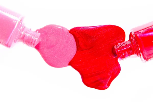 飛び散っと赤のマニキュア液ボトル — ストック写真