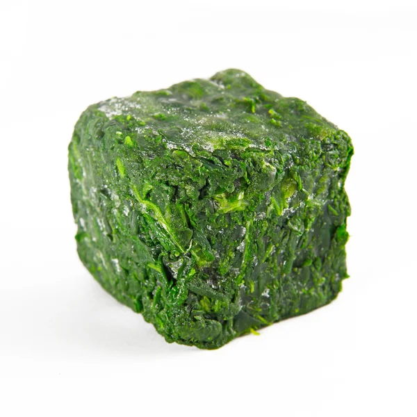 Block of frozen spinach — Stock Photo, Image