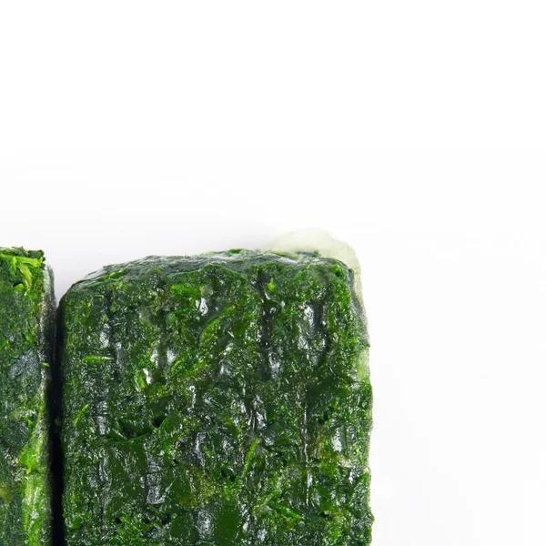 Blocks of frozen spinach — Stock Photo, Image