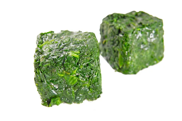 Blocks of frozen spinach — Stock Photo, Image