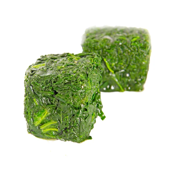 Blocks of frozen spinach — Stock Photo, Image