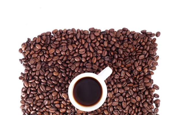 Kaffebönor och kopp — Stockfoto