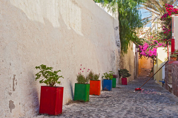 Beautiful streets of famous romantic white town in Santorini Island, Greece