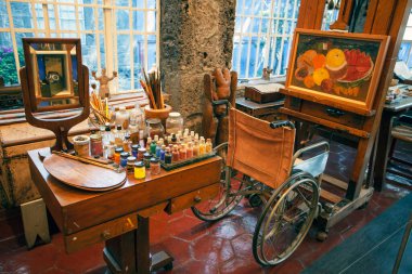 COYOACAN, MEXICO - MARCH 24, 2022: Work room fro painting in the Blue House (La Casa Azul), historic house and art museum dedicated to the life and work of Mexican artist Frida Kahlo clipart