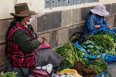 PERU - MAY 15, 2022: Peruvian people in traditional clothes in Cuzco.  Cusco, Peru, May 15, 2022