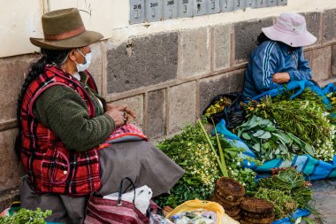 PERU - MAY 15, 2022: Peruvian people in traditional clothes in Cuzco.  Cusco, Peru, May 15, 2022