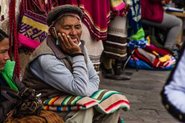 PERU - MAY 15, 2022: Peruvian people in traditional clothes in Cuzco.  Cusco, Peru, May 15, 2022