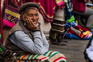 PERU - MAY 15, 2022: Peruvian people in traditional clothes in Cuzco.  Cusco, Peru, May 15, 2022