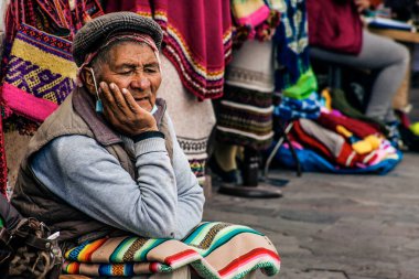 PERU - MAY 15, 2022: Peruvian people in traditional clothes in Cuzco.  Cusco, Peru, May 15, 2022