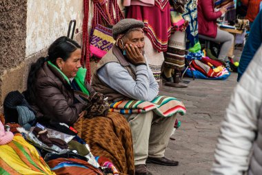 PERU - MAY 15, 2022: Peruvian people in traditional clothes in Cuzco.  Cusco, Peru, May 15, 2022