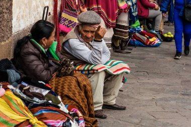 PERU - MAY 15, 2022: Peruvian people in traditional clothes in Cuzco.  Cusco, Peru, May 15, 2022