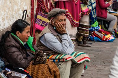 PERU - MAY 15, 2022: Peruvian people in traditional clothes in Cuzco.  Cusco, Peru, May 15, 2022