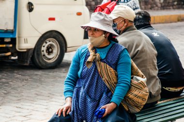 PERU - MAY 15, 2022: Peruvian people in traditional clothes in Cuzco.  Cusco, Peru, May 15, 2022