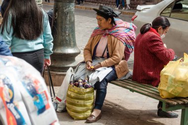 PERU - MAY 15, 2022: Peruvian people in traditional clothes in Cuzco.  Cusco, Peru, May 15, 2022