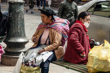PERU - MAY 15, 2022: Peruvian people in traditional clothes in Cuzco.  Cusco, Peru, May 15, 2022
