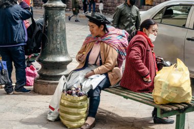 PERU - MAY 15, 2022: Peruvian people in traditional clothes in Cuzco.  Cusco, Peru, May 15, 2022