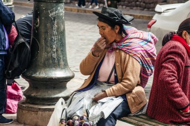 PERU - MAY 15, 2022: Peruvian people in traditional clothes in Cuzco.  Cusco, Peru, May 15, 2022