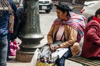PERU - MAY 15, 2022: Peruvian people in traditional clothes in Cuzco.  Cusco, Peru, May 15, 2022