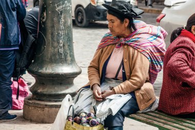 PERU - MAY 15, 2022: Peruvian people in traditional clothes in Cuzco.  Cusco, Peru, May 15, 2022
