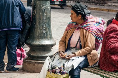 PERU - MAY 15, 2022: Peruvian people in traditional clothes in Cuzco.  Cusco, Peru, May 15, 2022