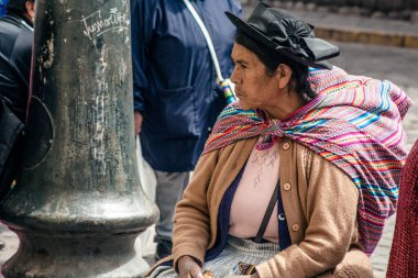 PERU - MAY 15, 2022: Peruvian people in traditional clothes in Cuzco.  Cusco, Peru, May 15, 2022
