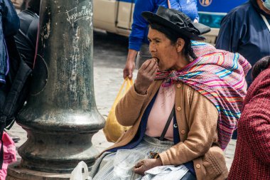 PERU - MAY 15, 2022: Peruvian people in traditional clothes in Cuzco.  Cusco, Peru, May 15, 2022