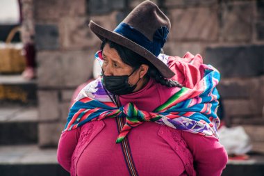 PERU - MAY 15, 2022: Peruvian people in traditional clothes in Cuzco.  Cusco, Peru, May 15, 2022