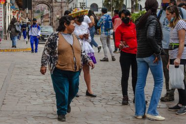 PERU - MAY 15, 2022: Peruvian people in traditional clothes in Cuzco.  Cusco, Peru, May 15, 2022