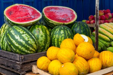 Summer market with watermelons and melons