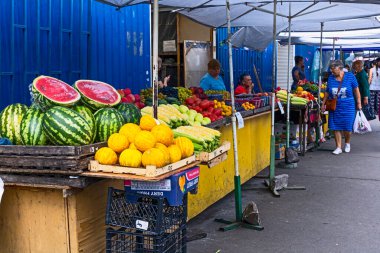 Kyiv, Ukraine - August 3, 2022: Old food market in Kiev city with people selling produce vendors fruits and vegetable stands