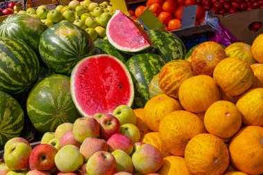 Summer market with watermelons and melons