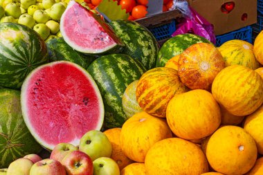 Summer market with watermelons and melons