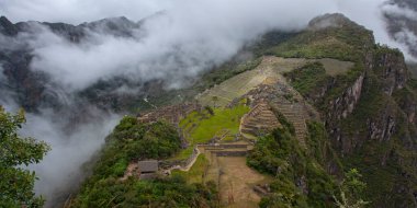Machu Picchu ancient city view from Huchu'y Picchu in cloudy weather