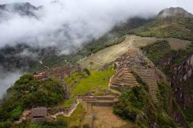 Machu Picchu ancient city view from Huchu'y Picchu in cloudy weather