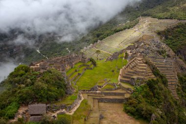 Machu Picchu ancient city view from Huchu'y Picchu in cloudy weather