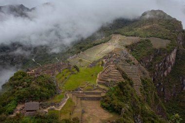 Machu Picchu ancient city view from Huchu'y Picchu in cloudy weather