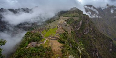 Machu Picchu ancient city view from Huchu'y Picchu in cloudy weather