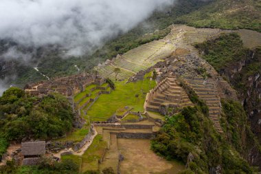 Machu Picchu ancient city view from Huchu'y Picchu in cloudy weather