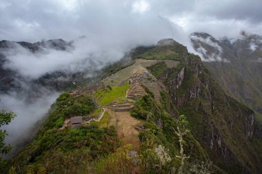 Machu Picchu ancient city view from Huchu'y Picchu in cloudy weather