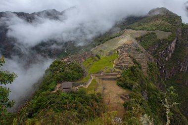 Machu Picchu ancient city view from Huchu'y Picchu in cloudy weather