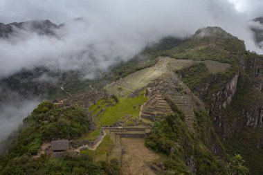 Machu Picchu ancient city view from Huchu'y Picchu in cloudy weather