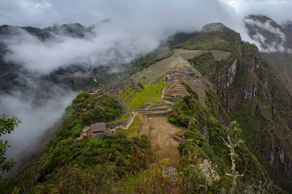 Machu Picchu ancient city view from Huchu'y Picchu in cloudy weather